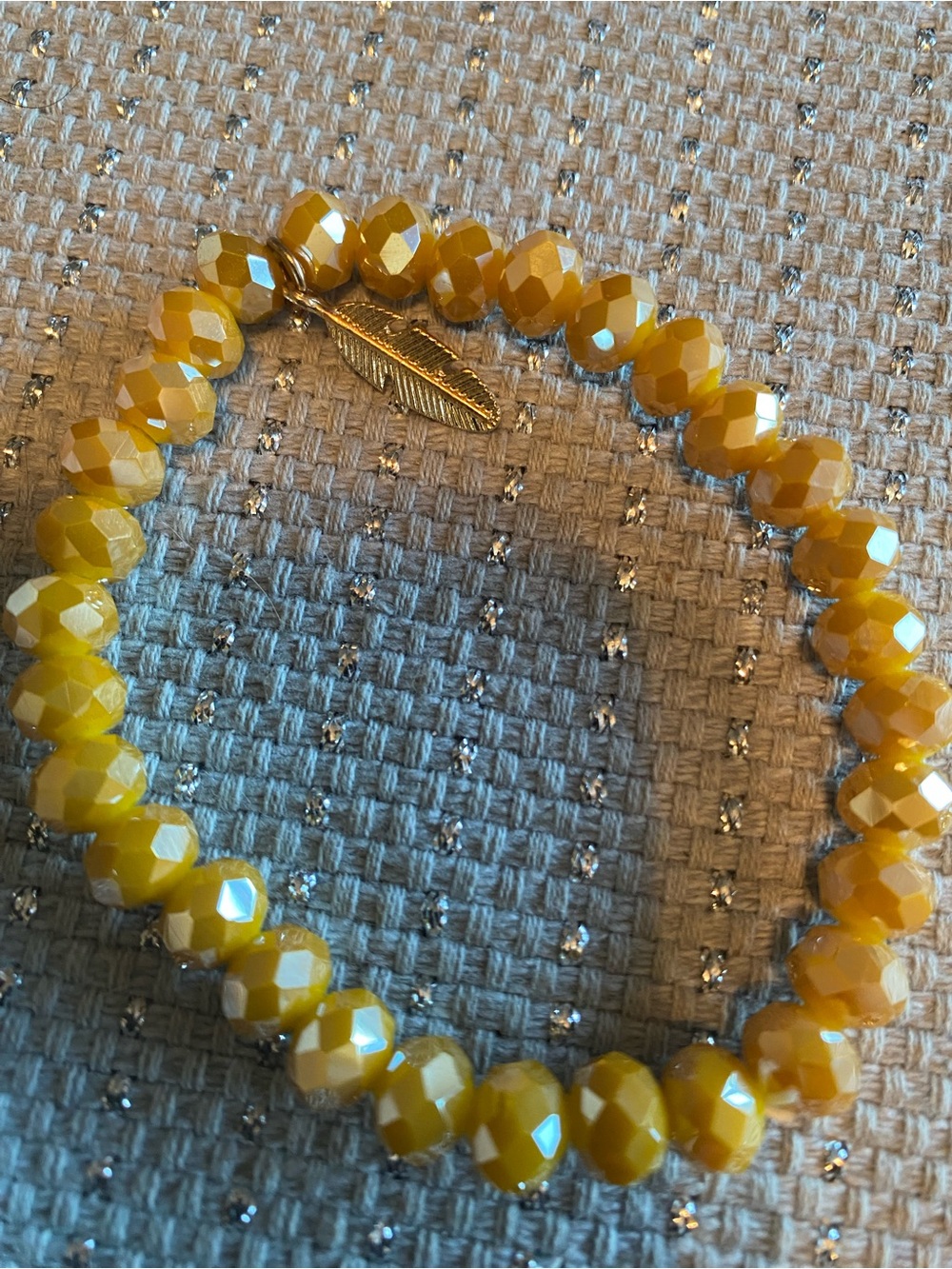 Yellow Faceted Bead Stretch Bracelet with Gold Feather Accent